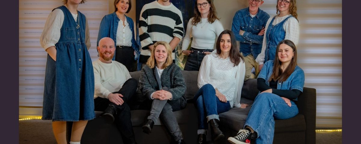 the morever and social firefly team sitting together on a sofa