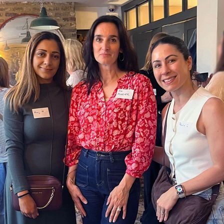 3 women at the MOREVER Meetup. They are smiling and enjoying themselves, the atmosphere is warm and friendly