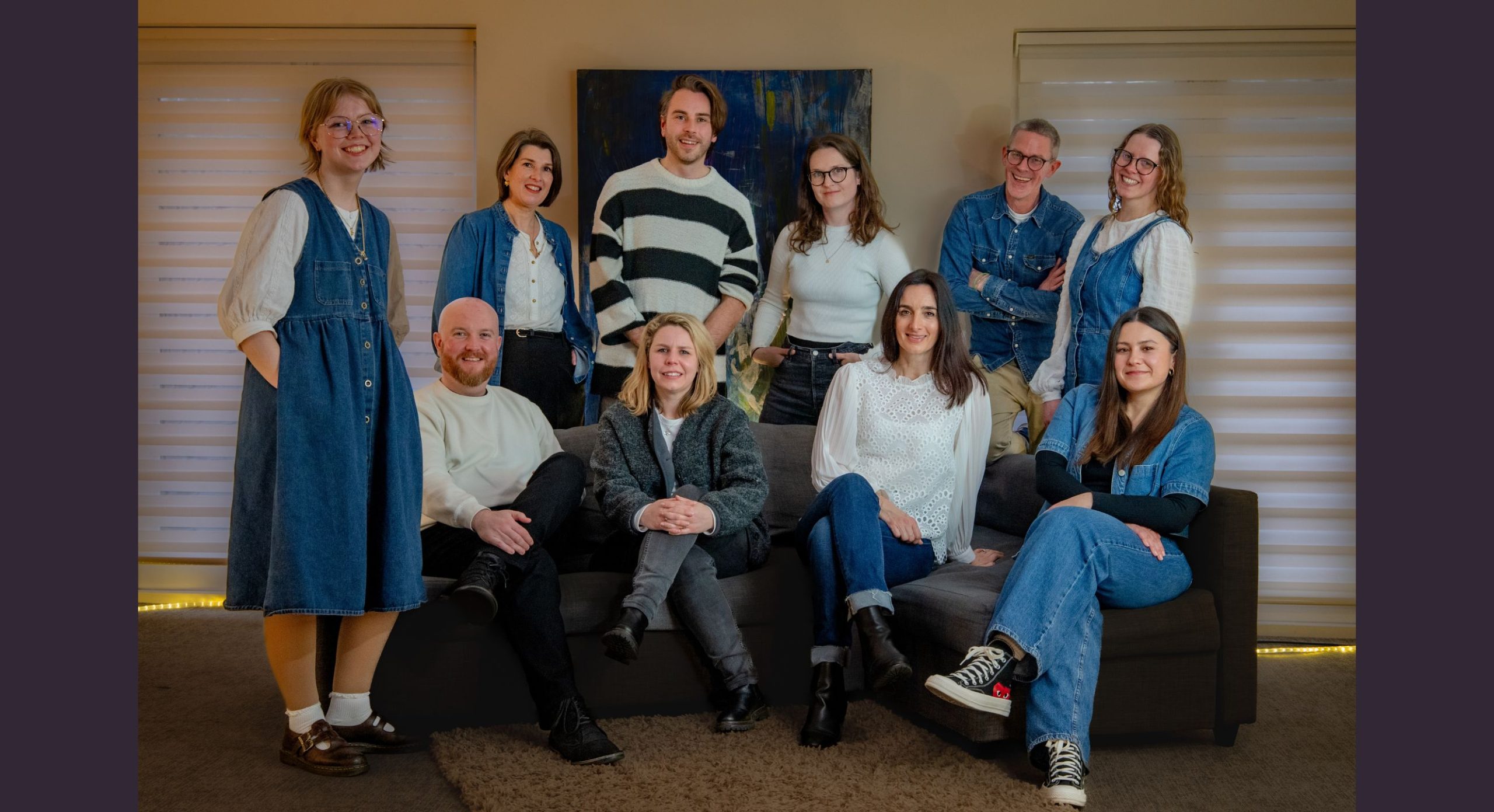 the morever and social firefly team sitting together on a sofa