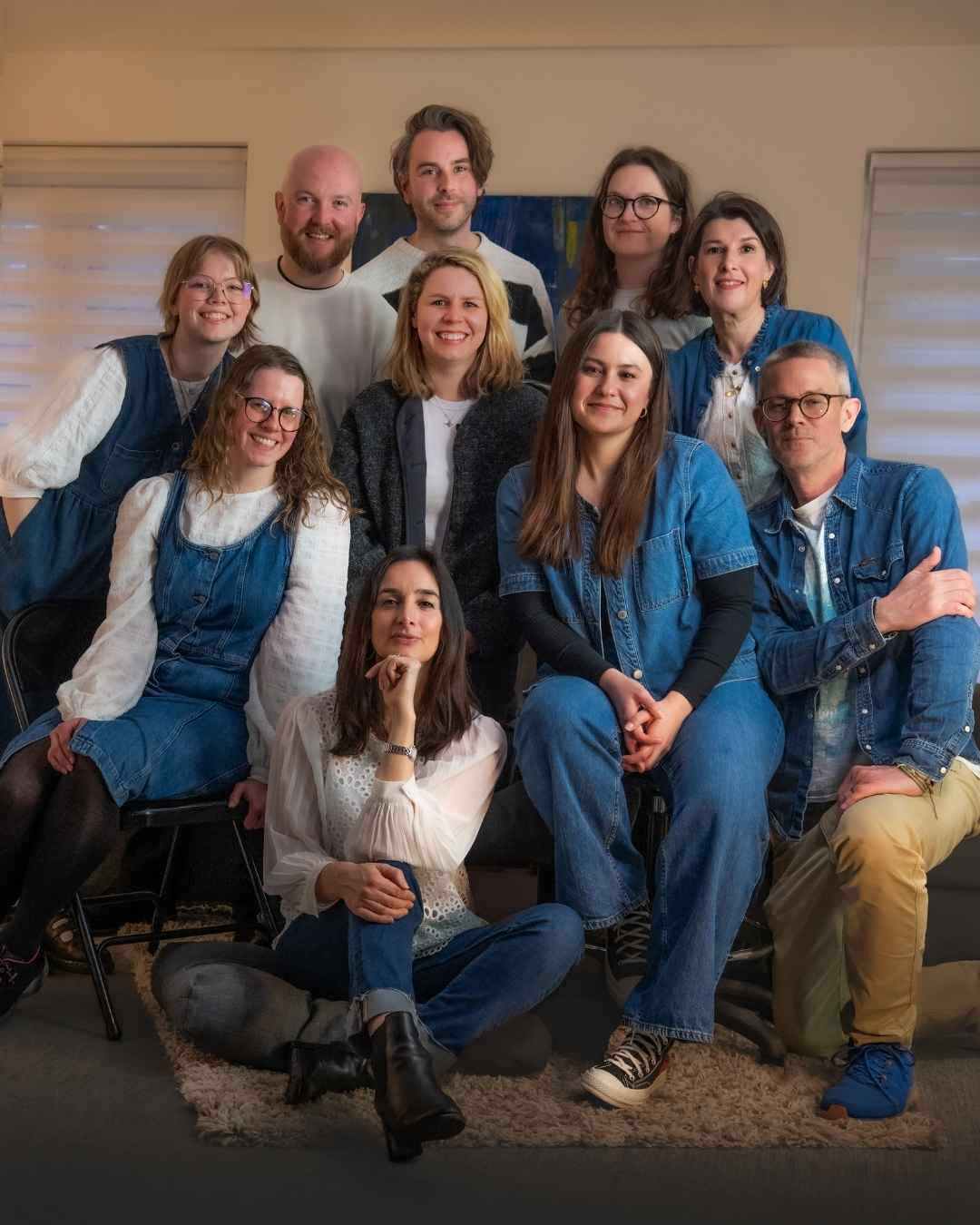 the MOREVER and Social Firefly team all together sitting on a sofa and smiling at the camera